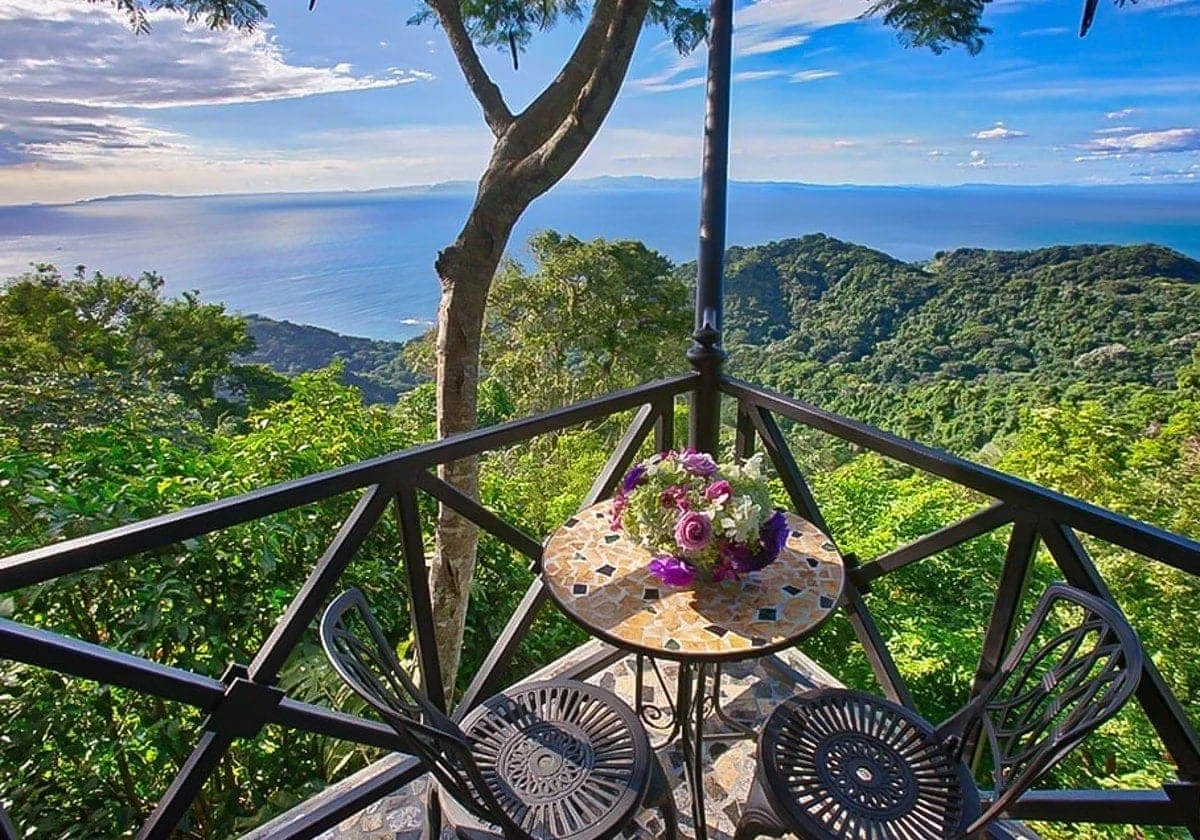 Amazing ocean and mountain views from a balcony.