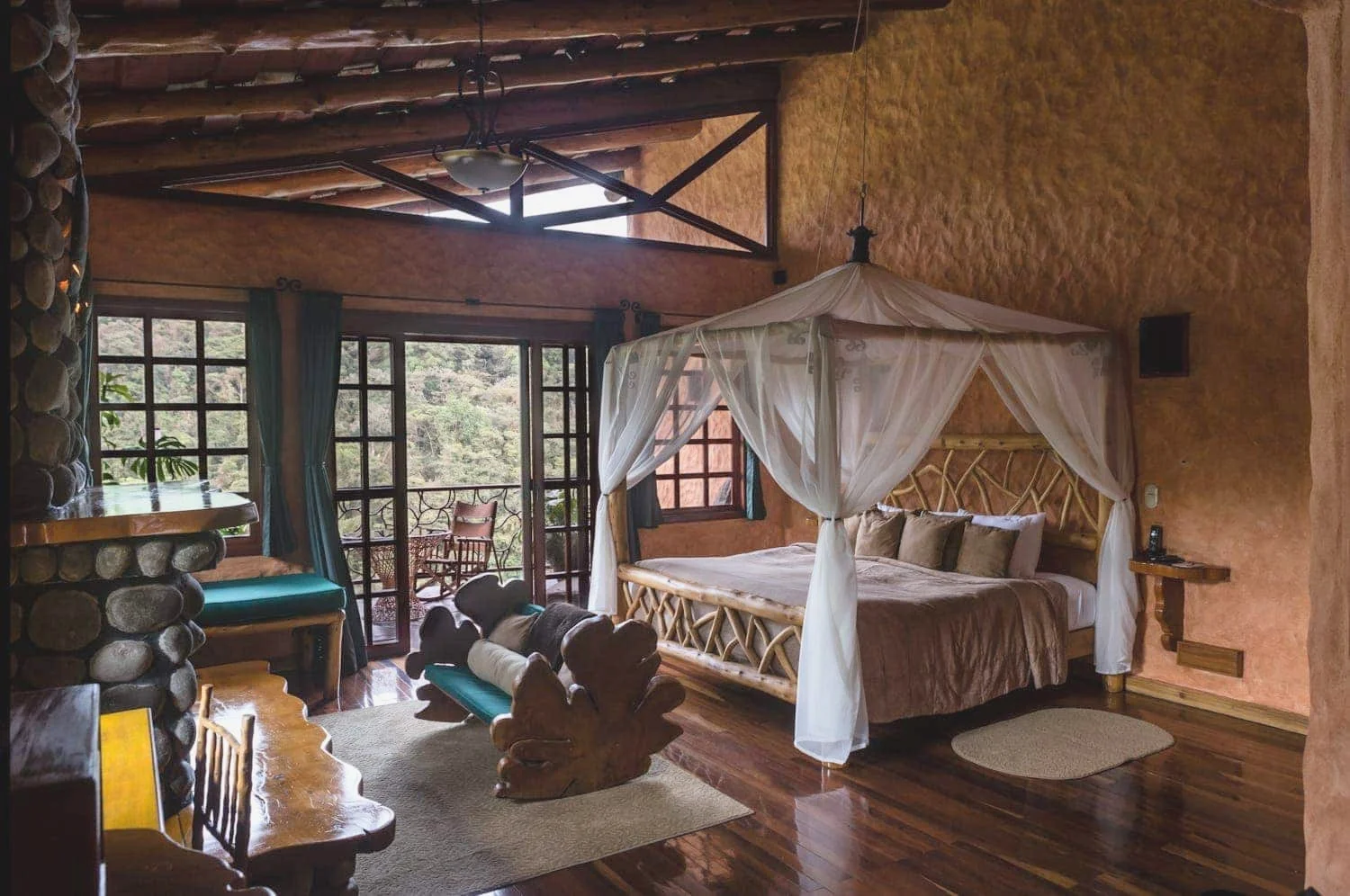 This rustic honeymoon suite at Peace Lodge in Poas overlooks a cloud forest and the Poas Volcano.