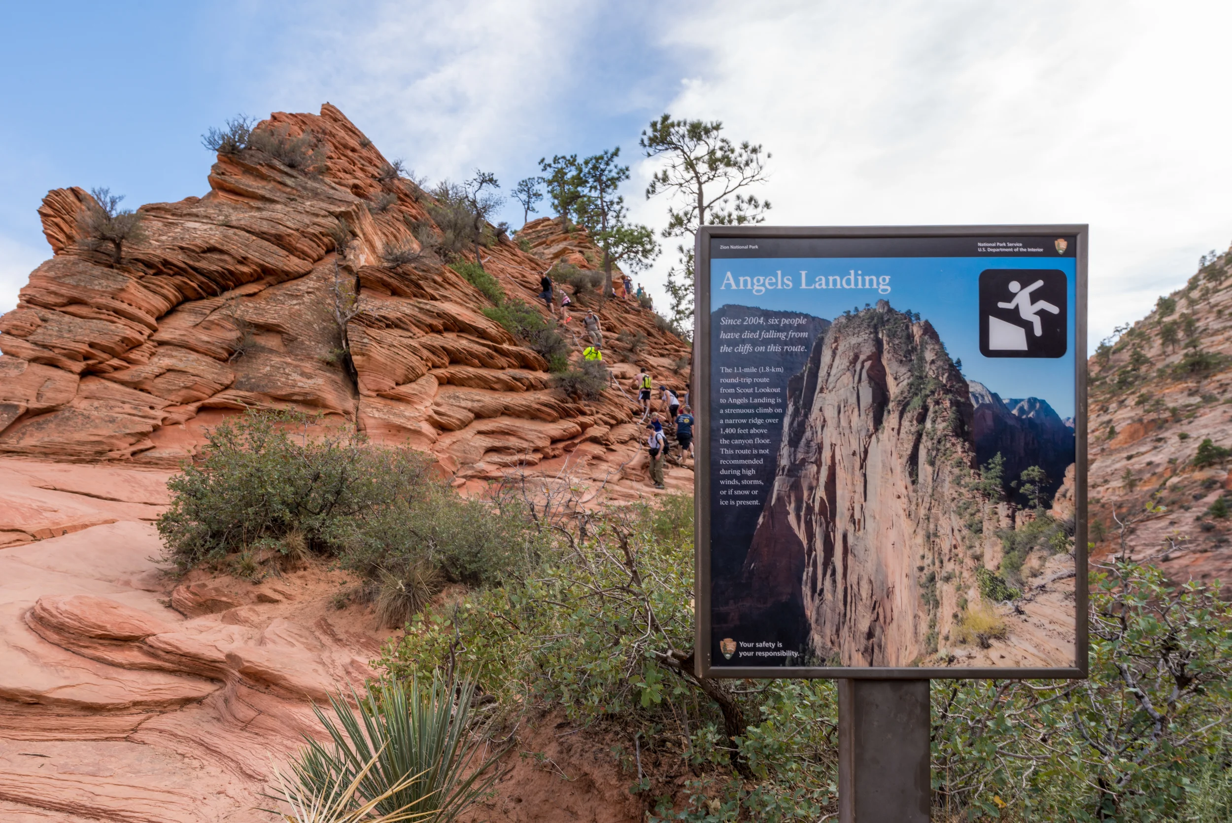 A sign at Scout Lookout explains the dangers of continuing to the top of Angels Landing. Six people have died from falling off the cliff since 2004.