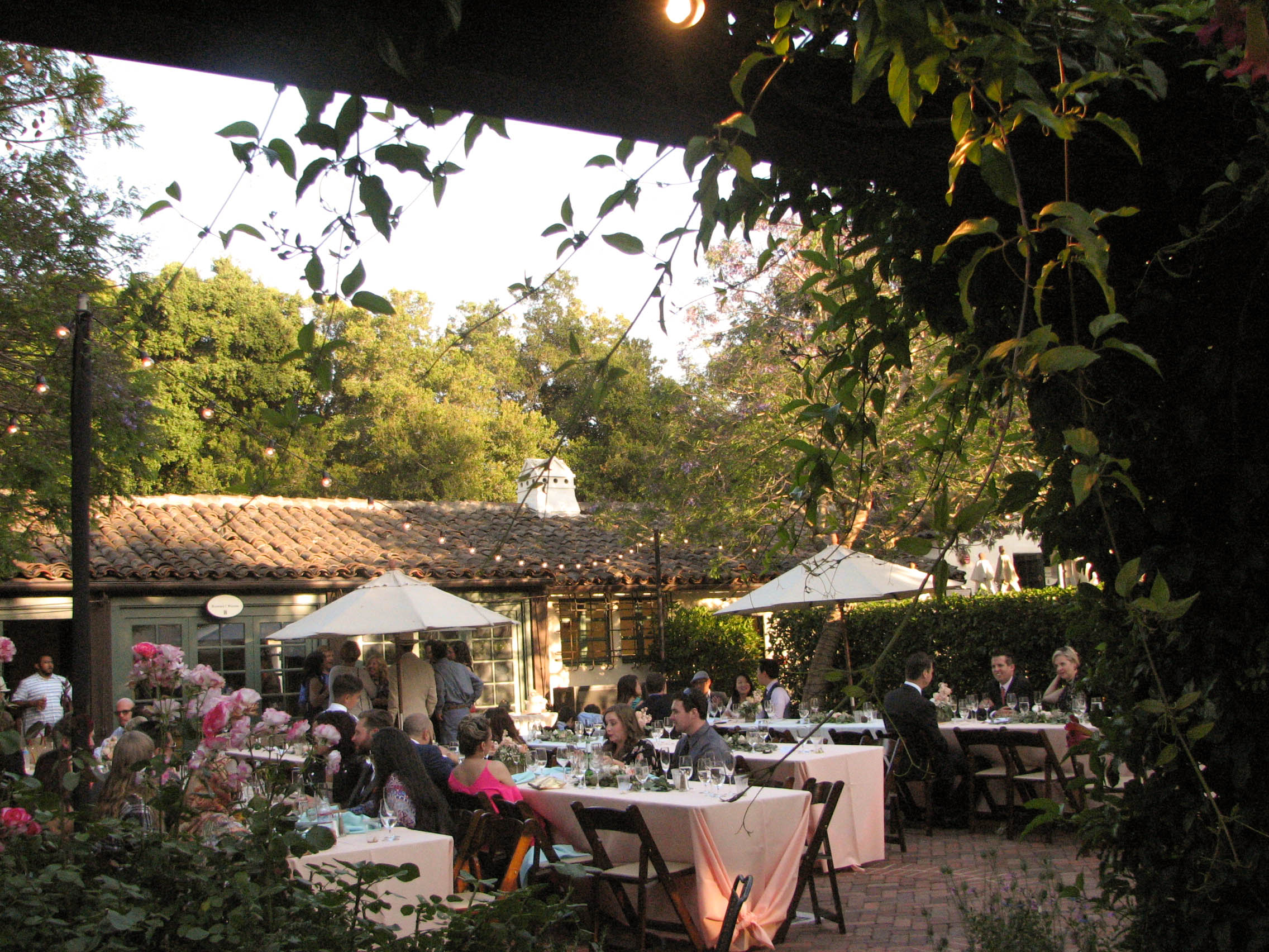 Guests eating dinner on the patio.