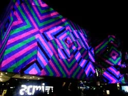ACMI lights up along Flinders Street.