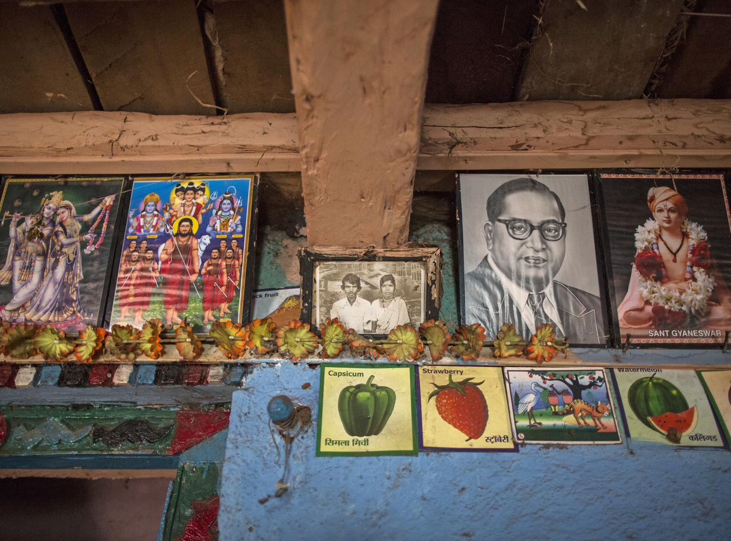 A old photo frame of Namdeo and Bagabai is seen on a wall inside their house in Denganmal village. 