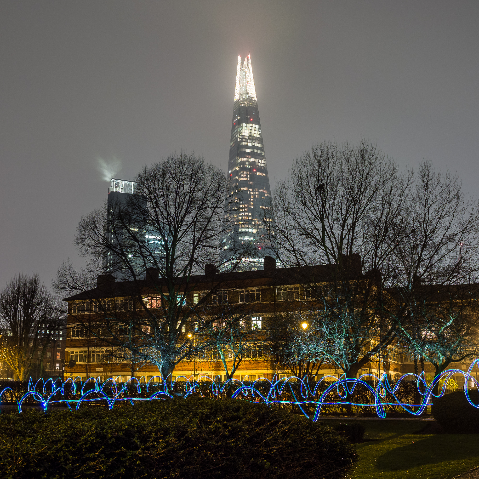 Light-painted trees and LED trails under the Shard
