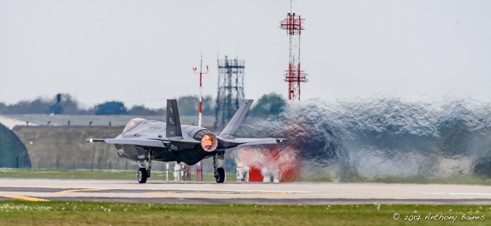 Piling on the gas: an F-35A leaves a trail of jelly air as its afterburner propels it along the runway