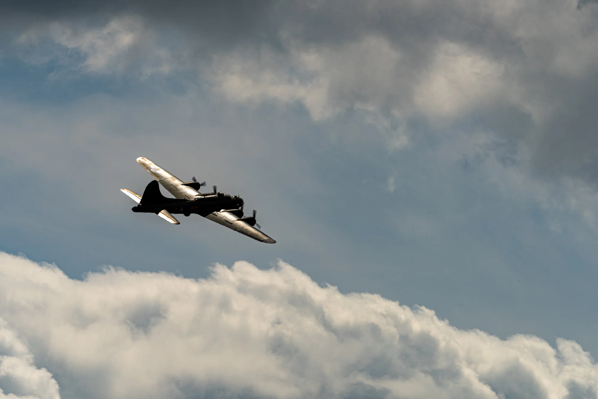 Flying Fortress, alone among the clouds