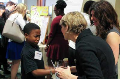 Businessman Frank greets Nell Kiesel, Citizen Schools' Special Advisor for Strategic Initiatives, with a firm handshake at the Massachusetts WOW! NOW gala!