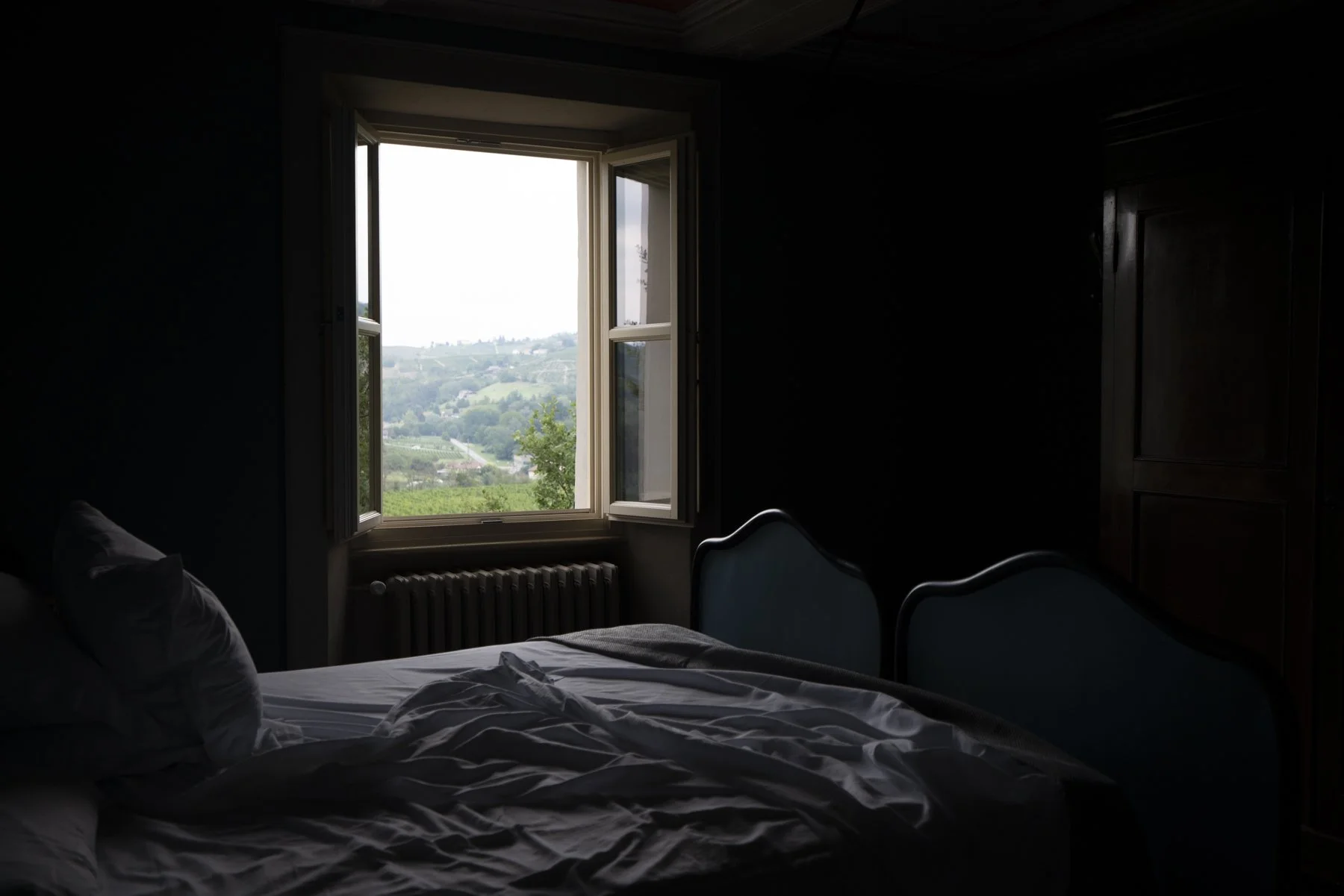 A view of the hills from a window of one of the room of the facility.