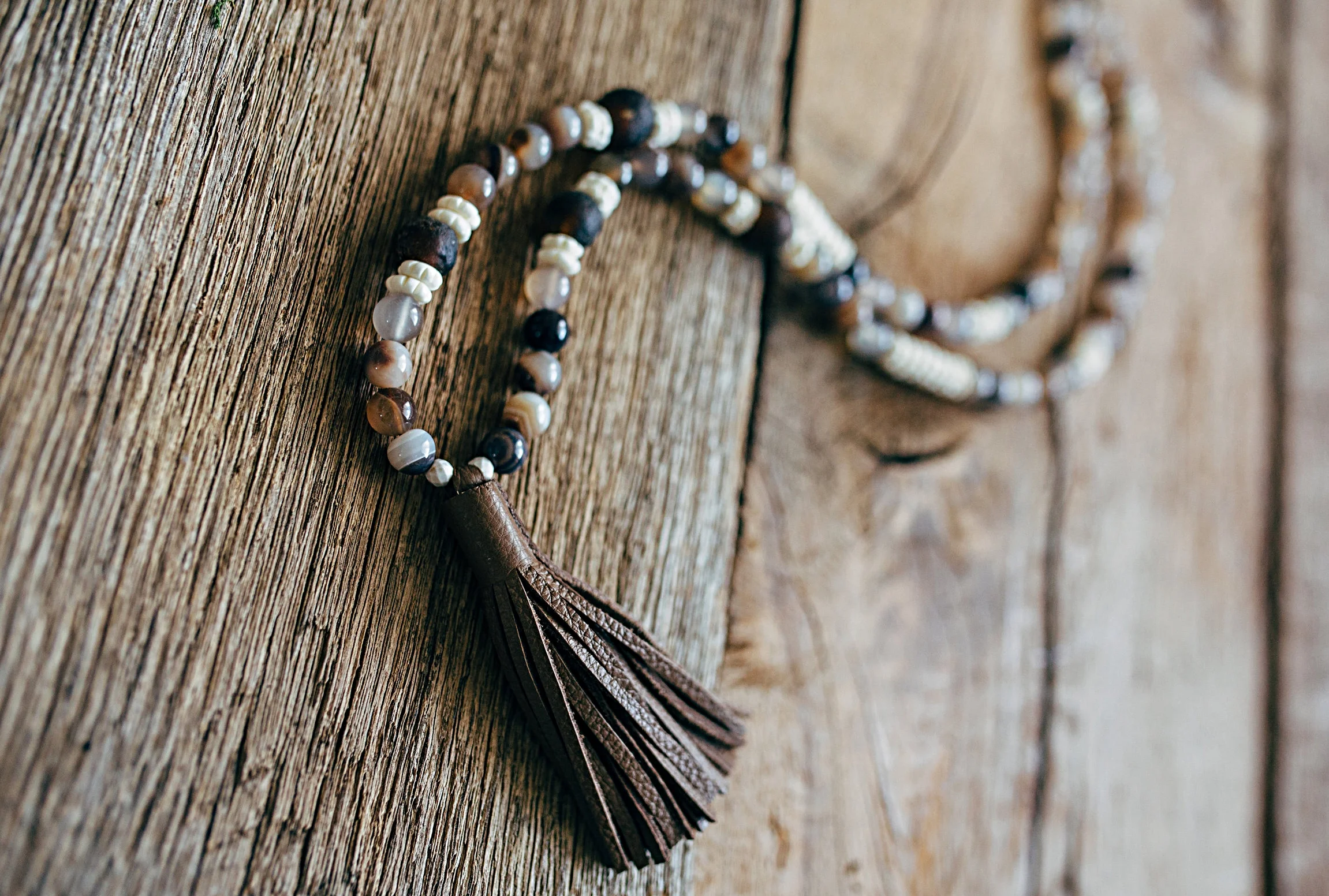 Leather Tassel on Polished River Stone 