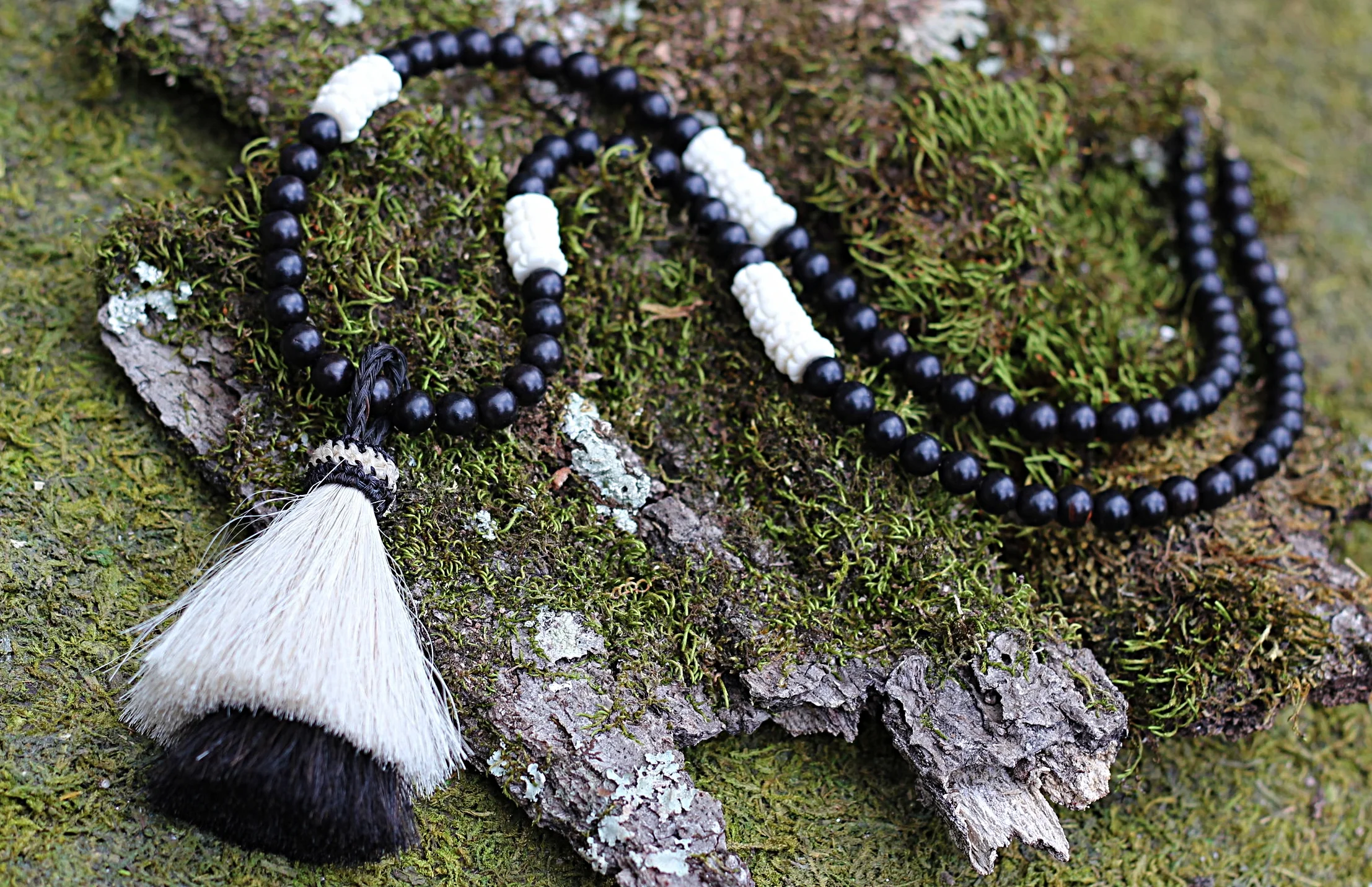 Horsehair Tassel on Black Driftwood