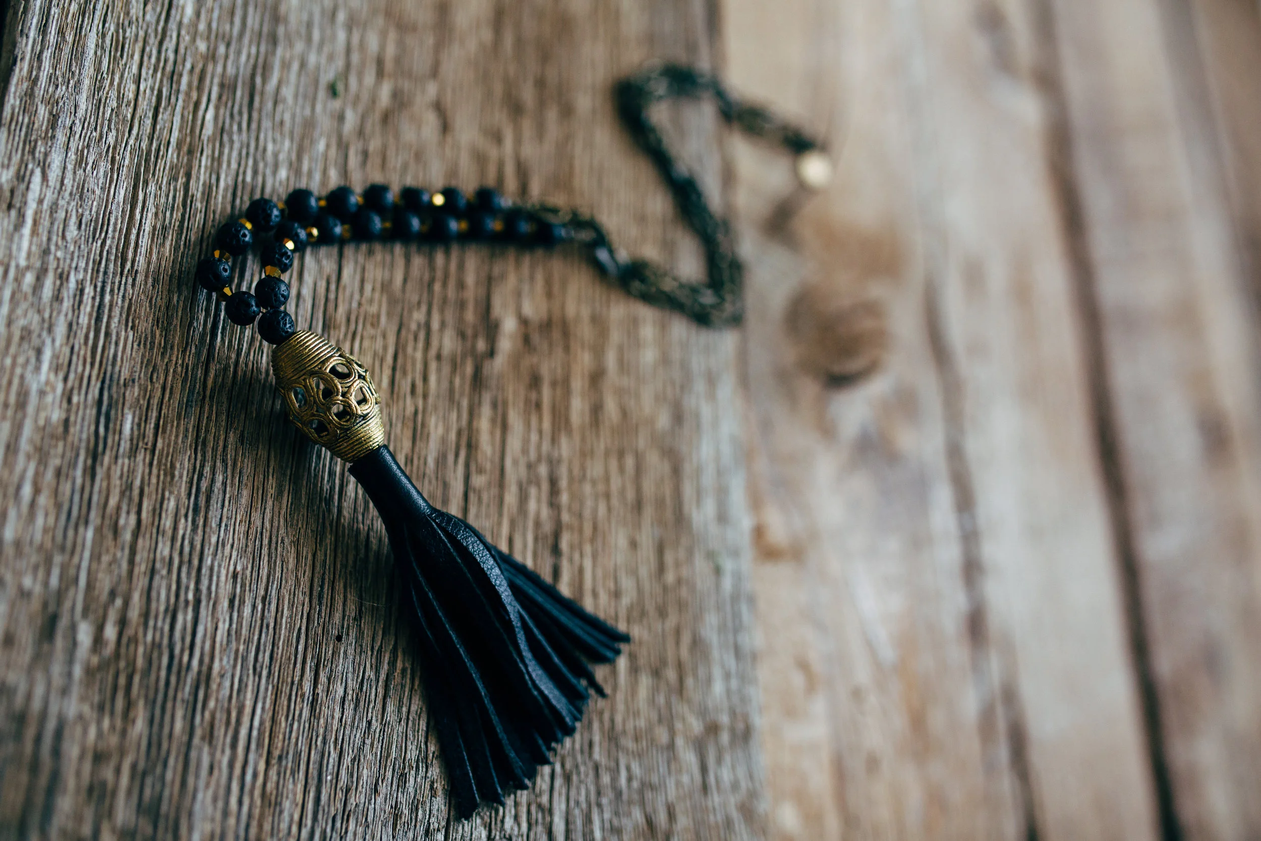 Leather Tassel on African Brass and Lava Rock