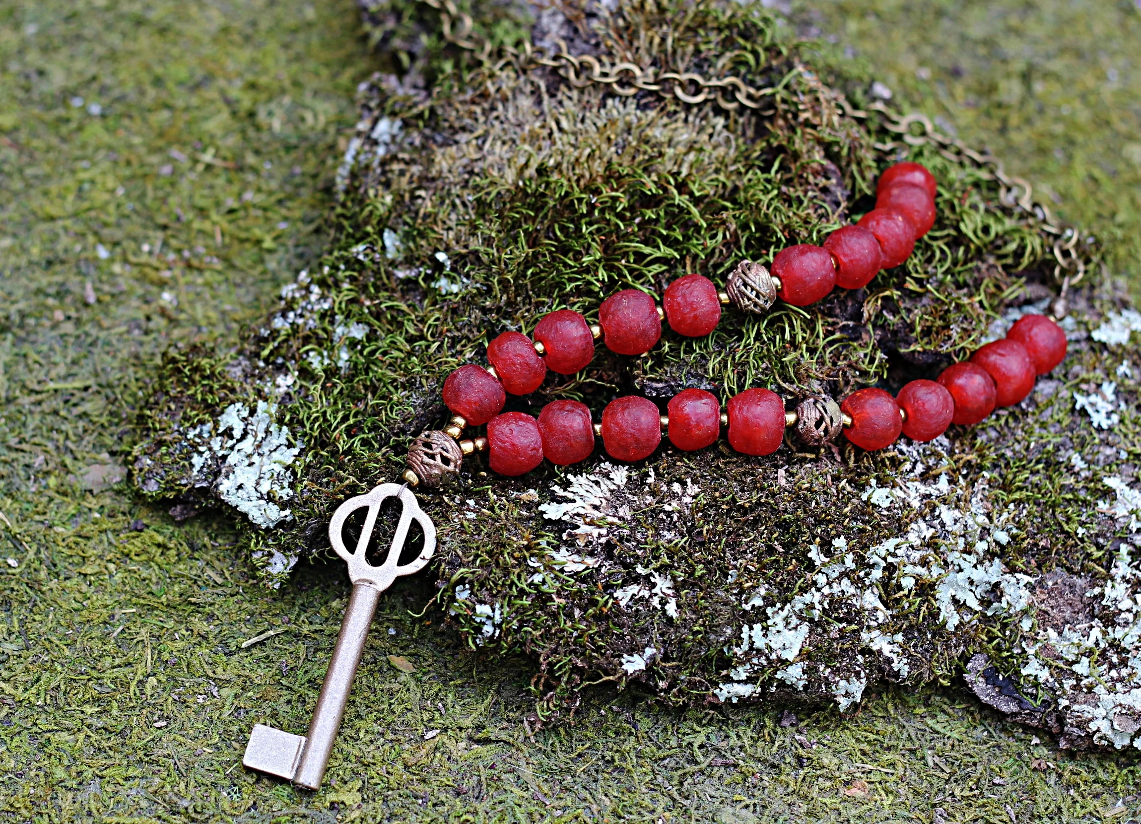 Gold Key on Red African Trade Beads