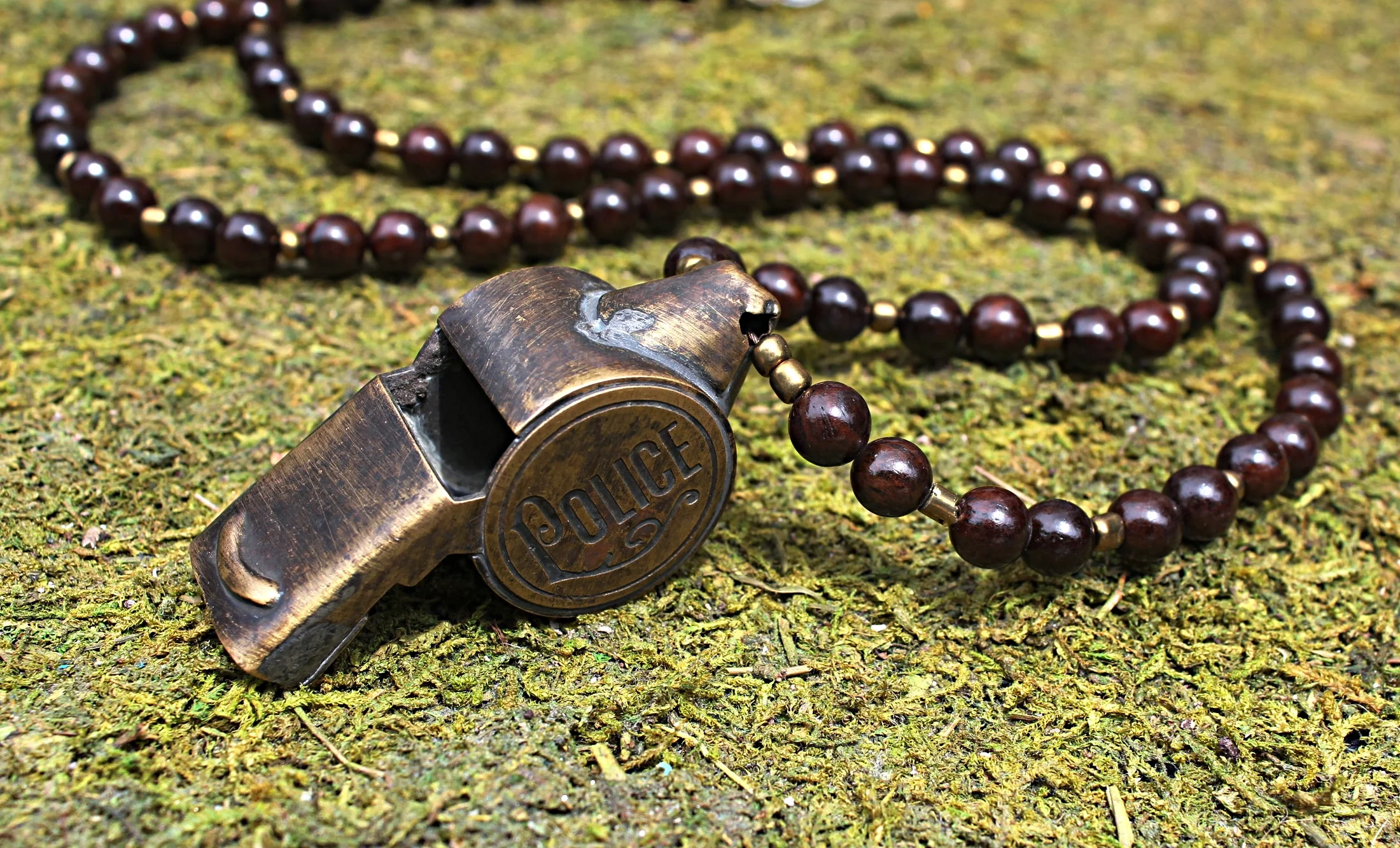 Metro Police Whistle on Brown Wood