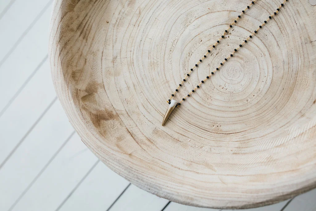 Gold Dipped Antler Tip on Onyx