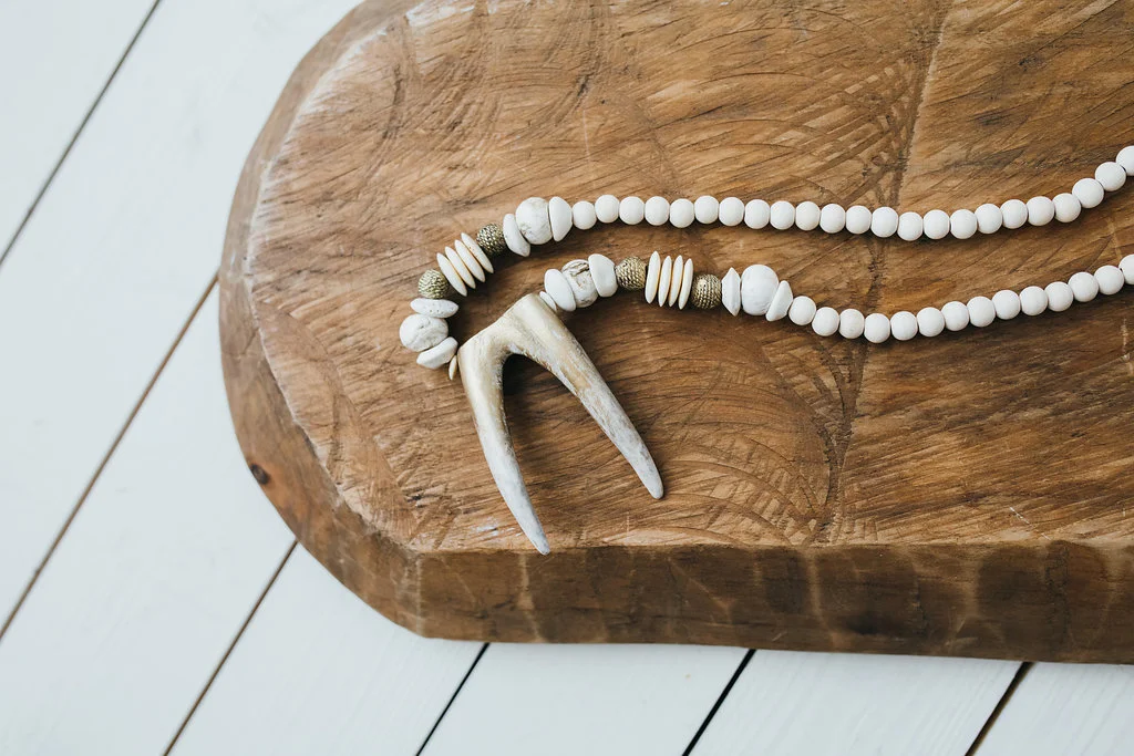 Gold Brushed Antler Tip on White Stone