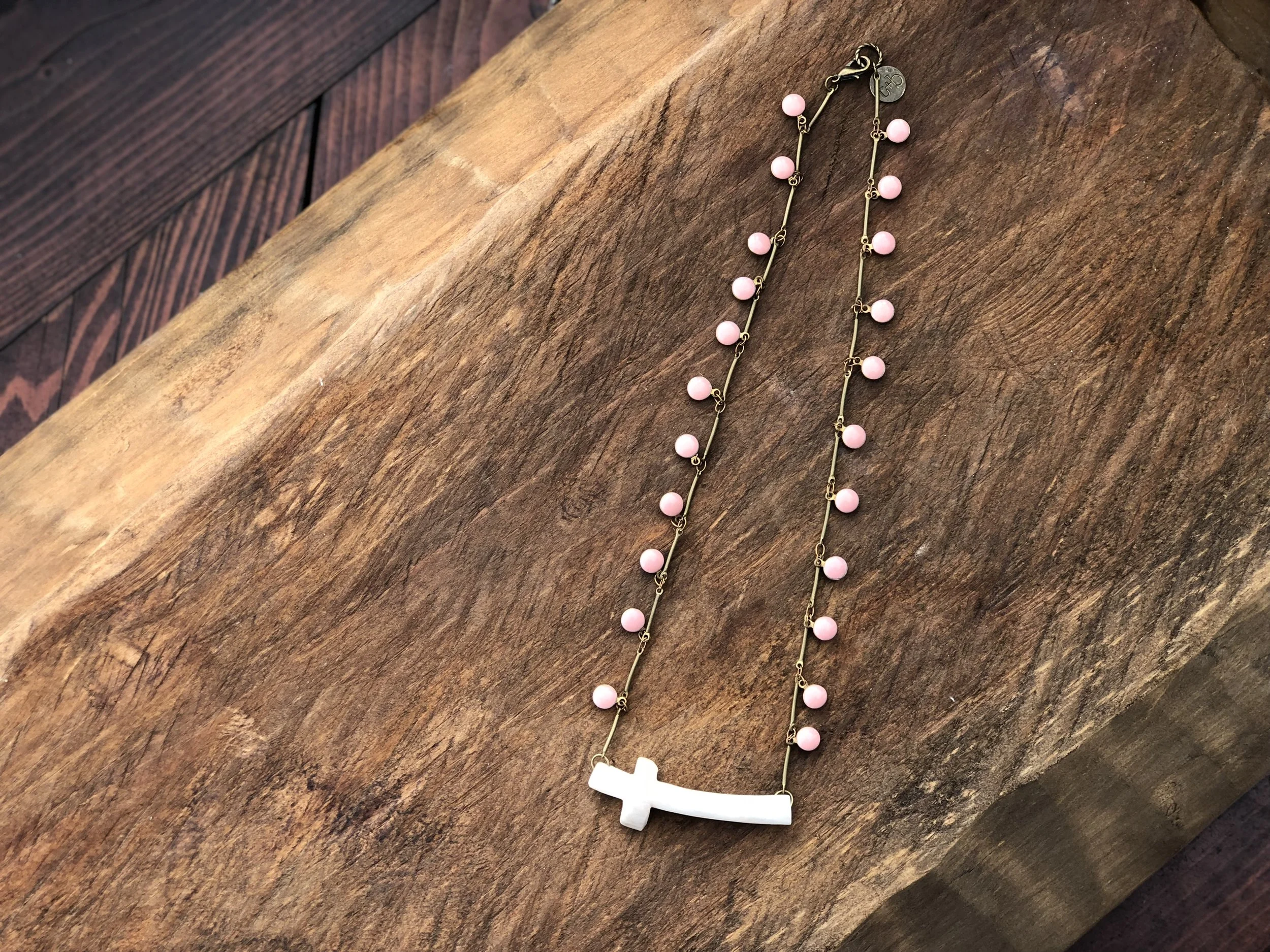 Antler Cross on Pink Stone