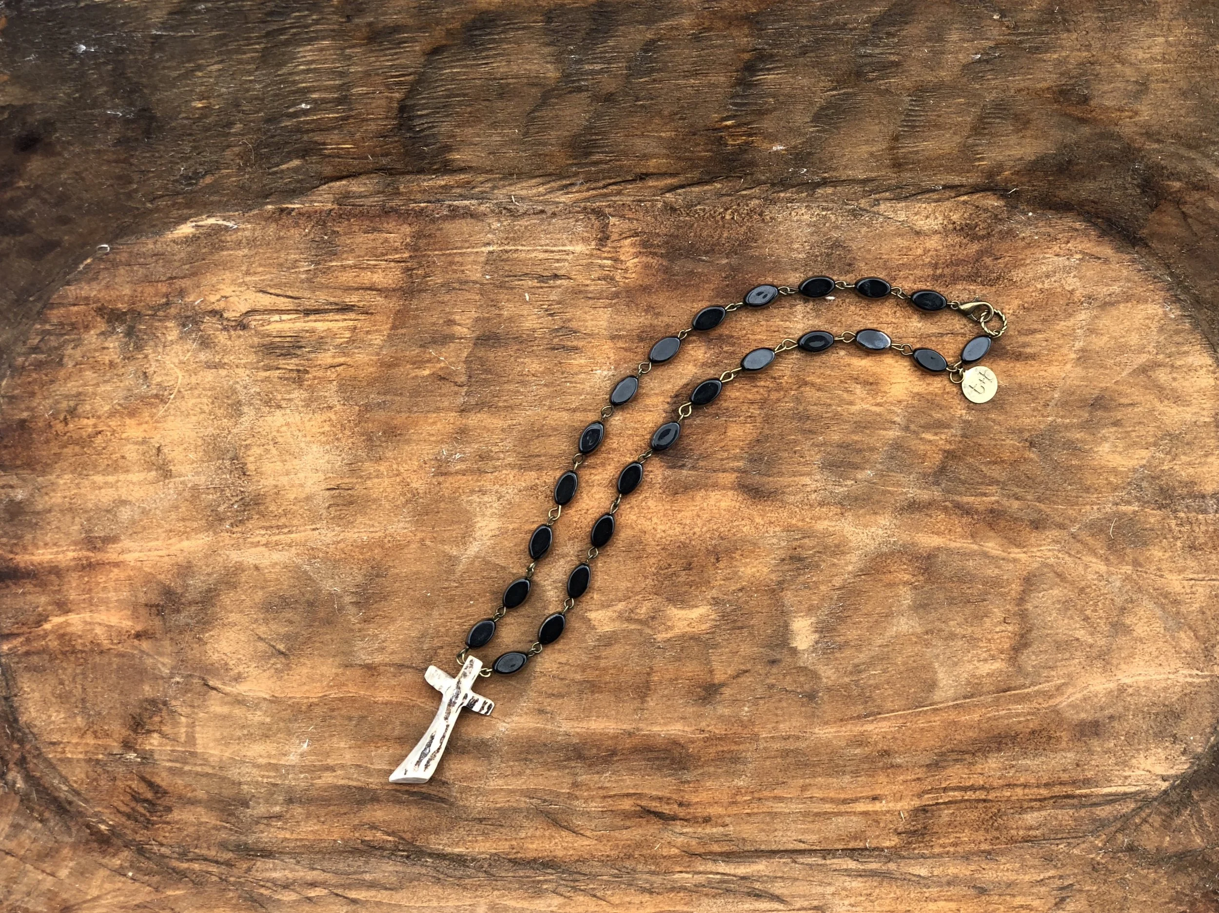 Gnarly Cross on Black Agate Stones