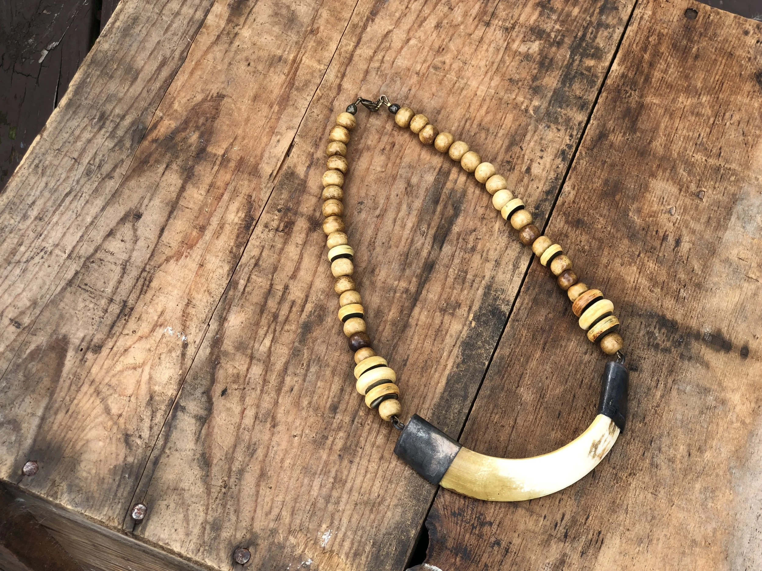 Tusk on Brown Ox Bone 