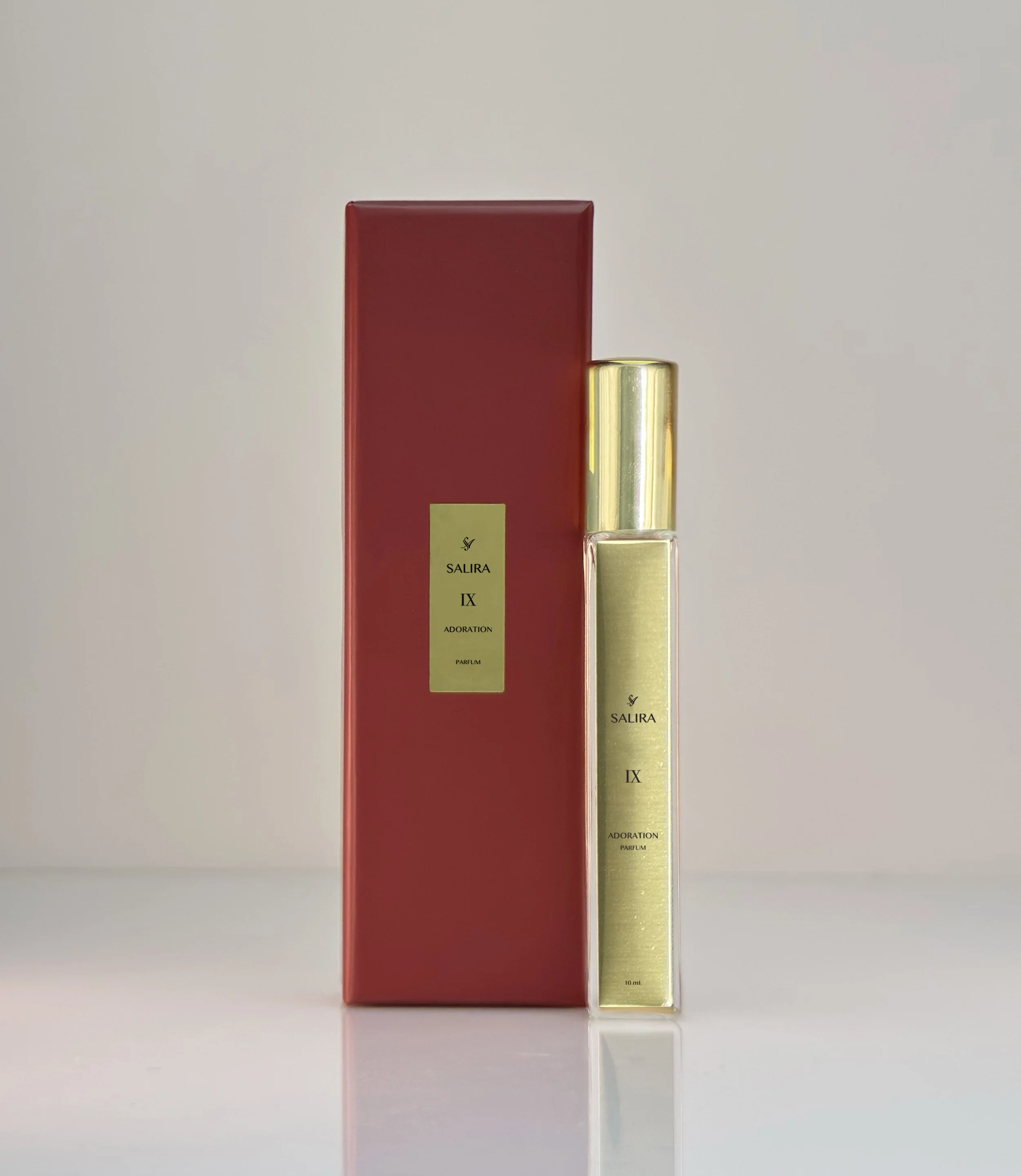 IX ADORATION TRAVEL BOX AND BOTTLE.jpg