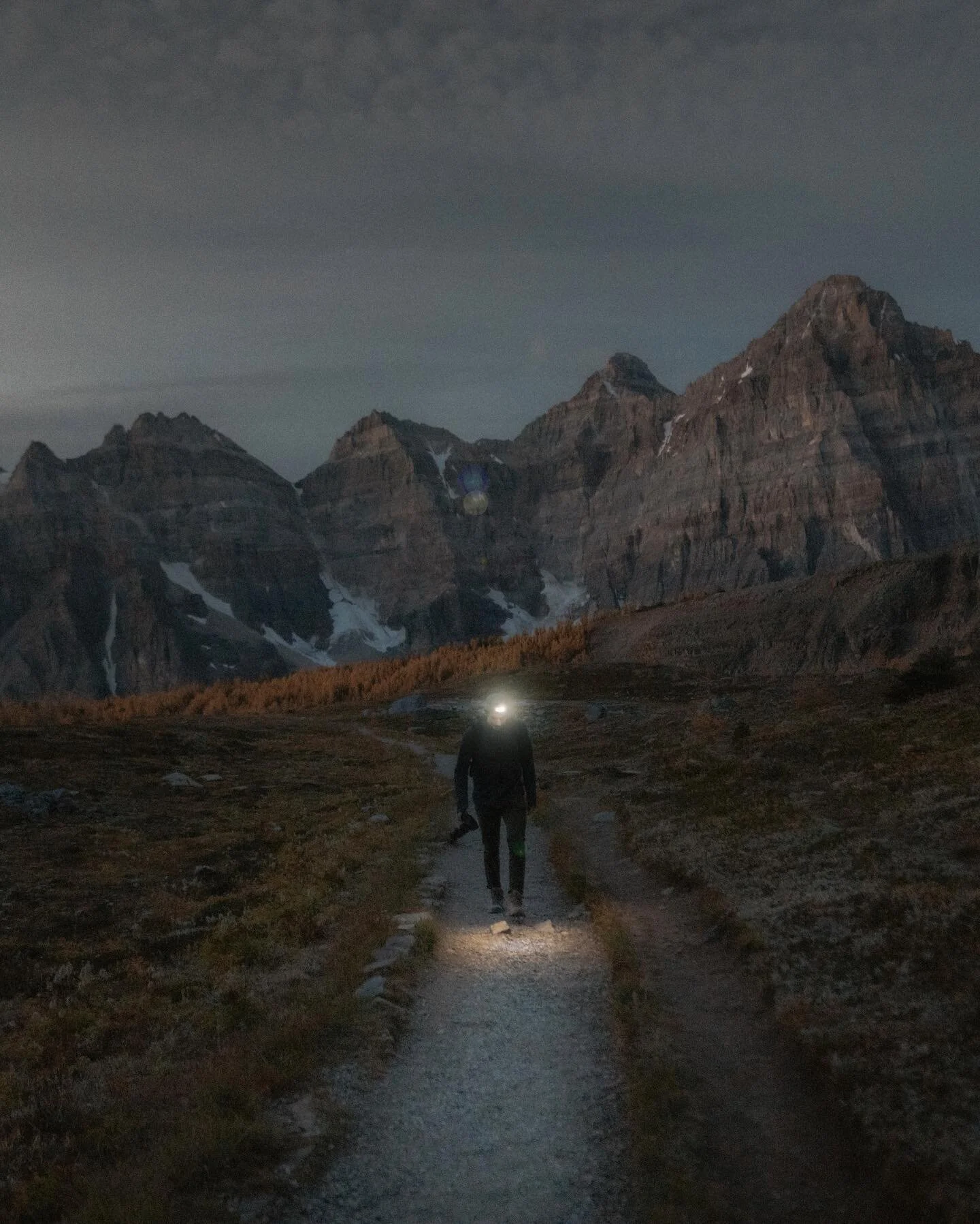 We started at the trailhead in the early morning darkness and made our way up into the Larch Valley. As we got higher, I found myself stopping every few minutes to take pictures of the light slowly revealing the mountain range behind us. 10/10 recomm