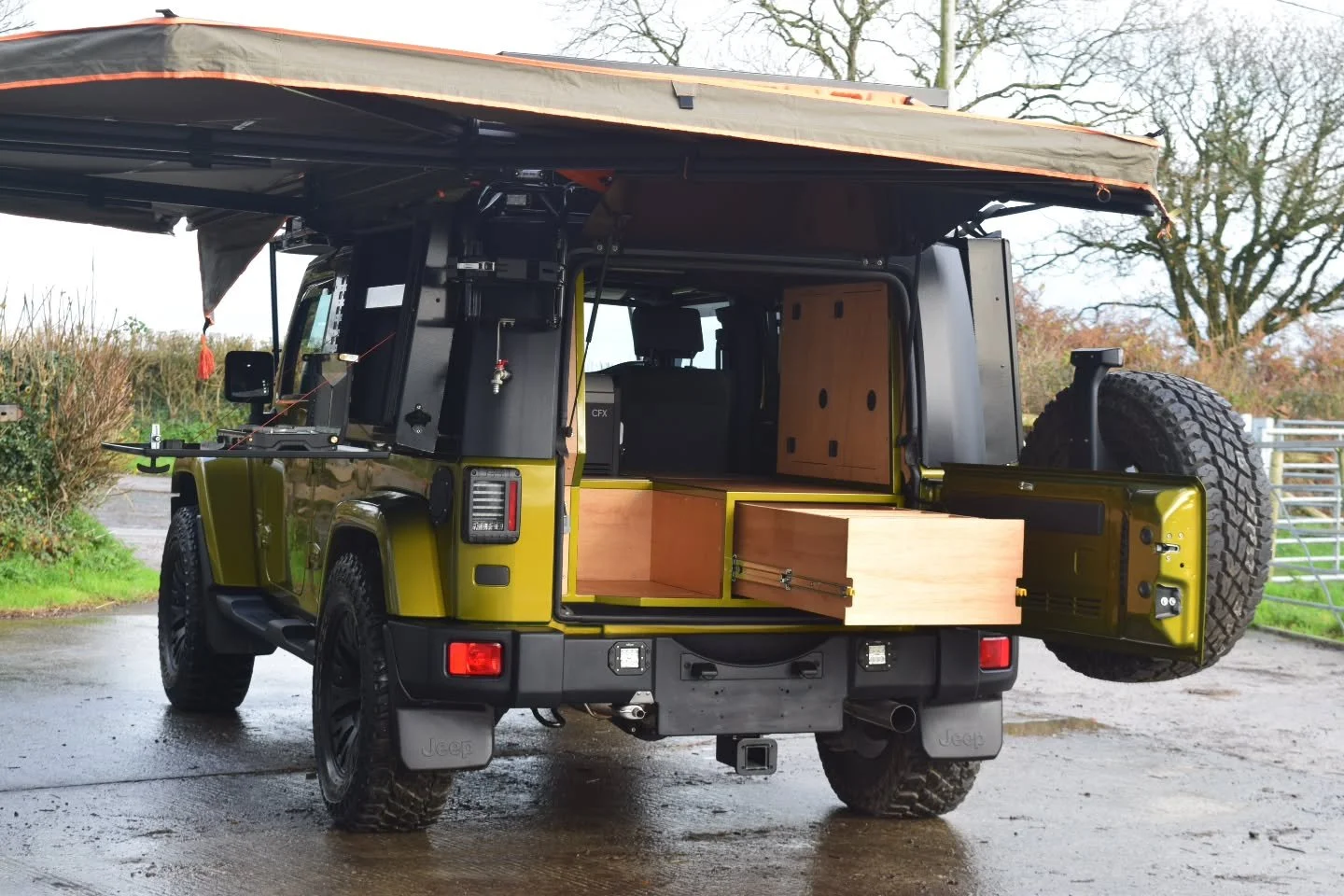 BESPOKE EXPEDITION ROOF RACK

Next up on the expedition build list was a bespoke heavy duty tubular steel roof rack with built in windscreen mesh guard. Powder coated in matt black and featuring a brushed stainless steel LAO tag, the rack protects th