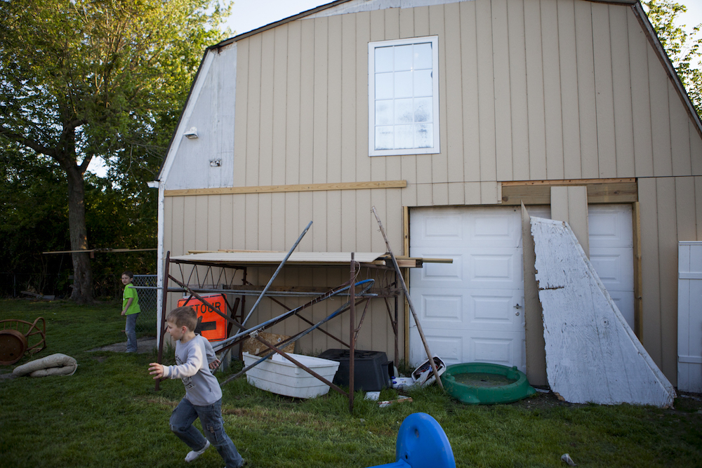 Richie's sons Boog and Jordyn run around in the yard.