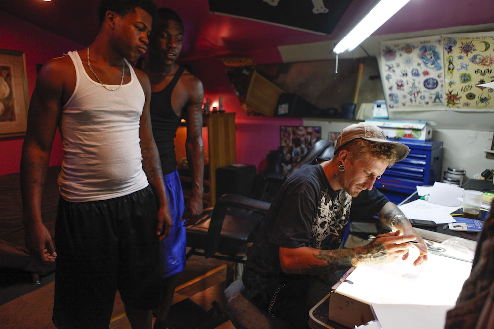 Richie sketches out tattoo ideas.