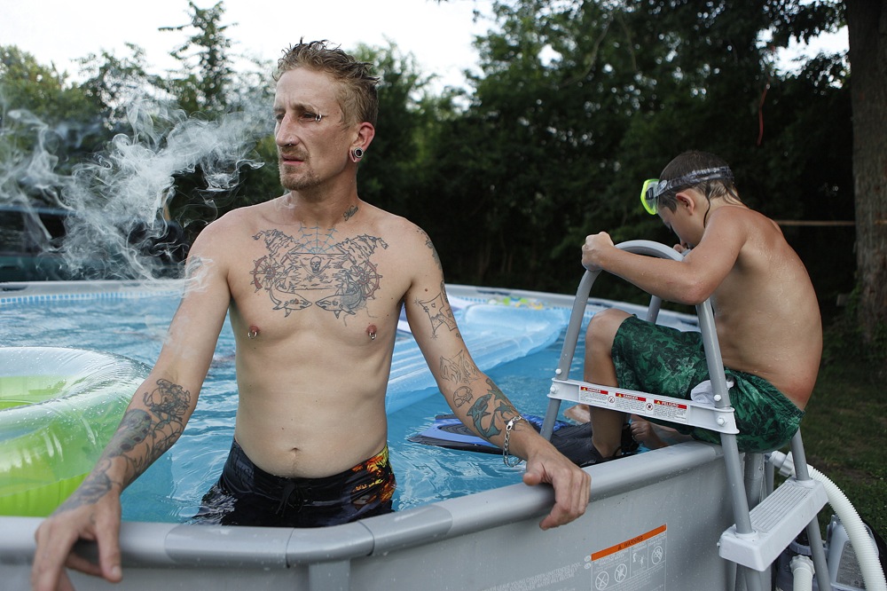 Richie smokes in his pool.