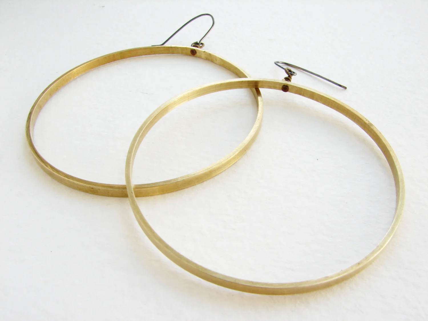 Super large hoop earrings in gold tone brass