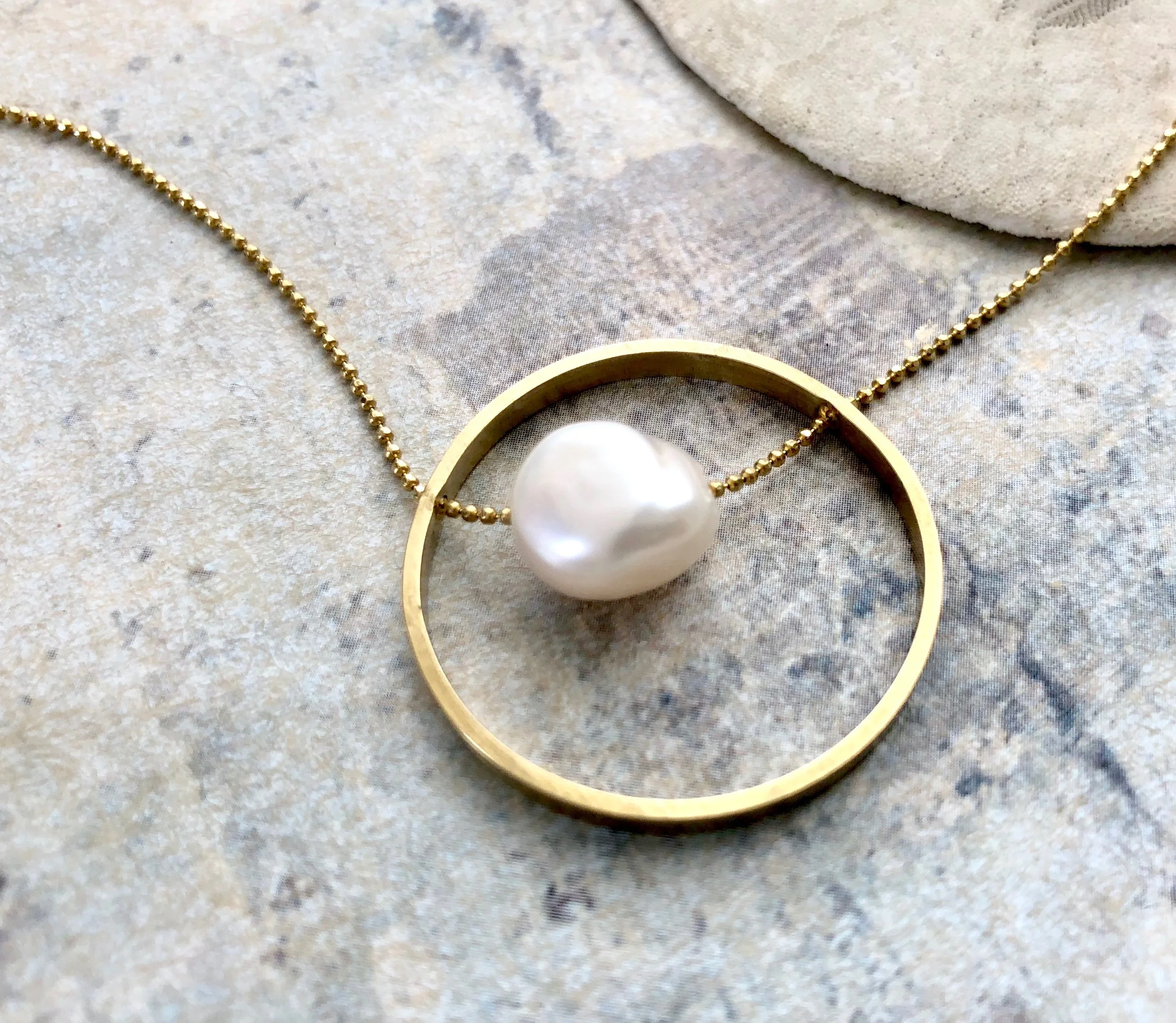 Pearl in a circle necklace, Infinity pearl necklace, Modern pearl necklace