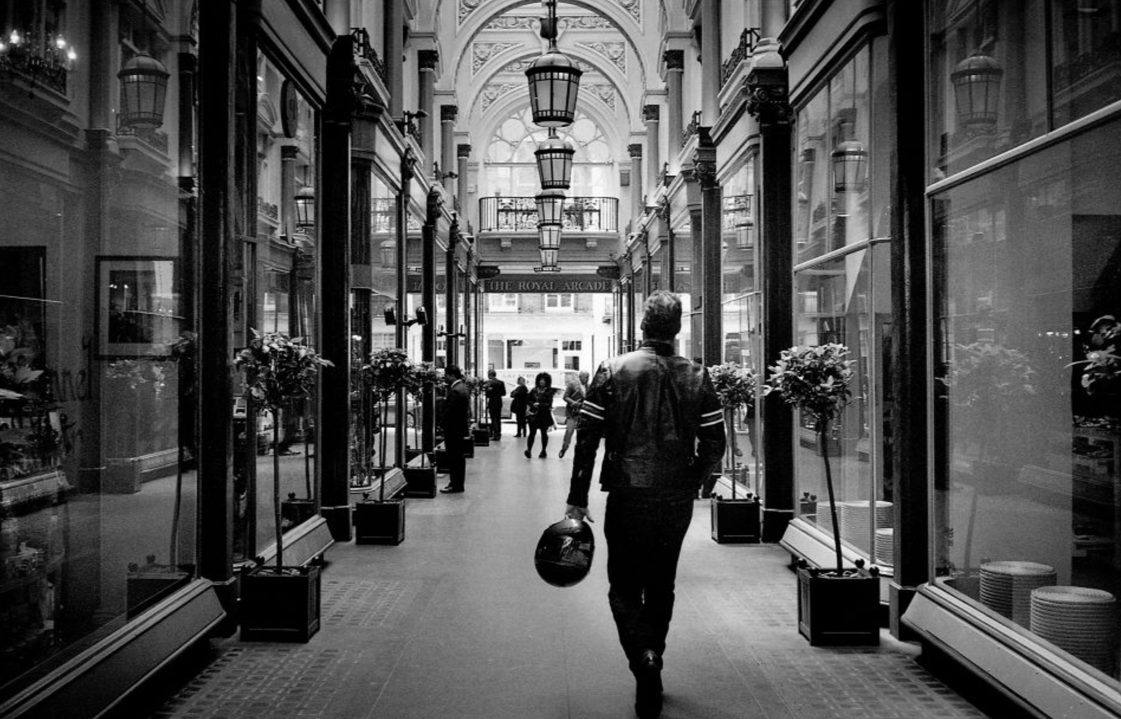 Biker on the Royal Arcade, Bond Street, London, England (18th June 2012) // Minolta Hi-Matic AF2, Ilford XP2 400, Epson V330. I've always been interested in combining opposites - old with new, east with west, heritage with innovation. I enjoyed the perspective in this moment: both the perspective of looking down the Royal Arcade and the perspective of how well the Royal Arcade, a Victorian shopping arcade built in 1879, related to the motorcyclists outfit.