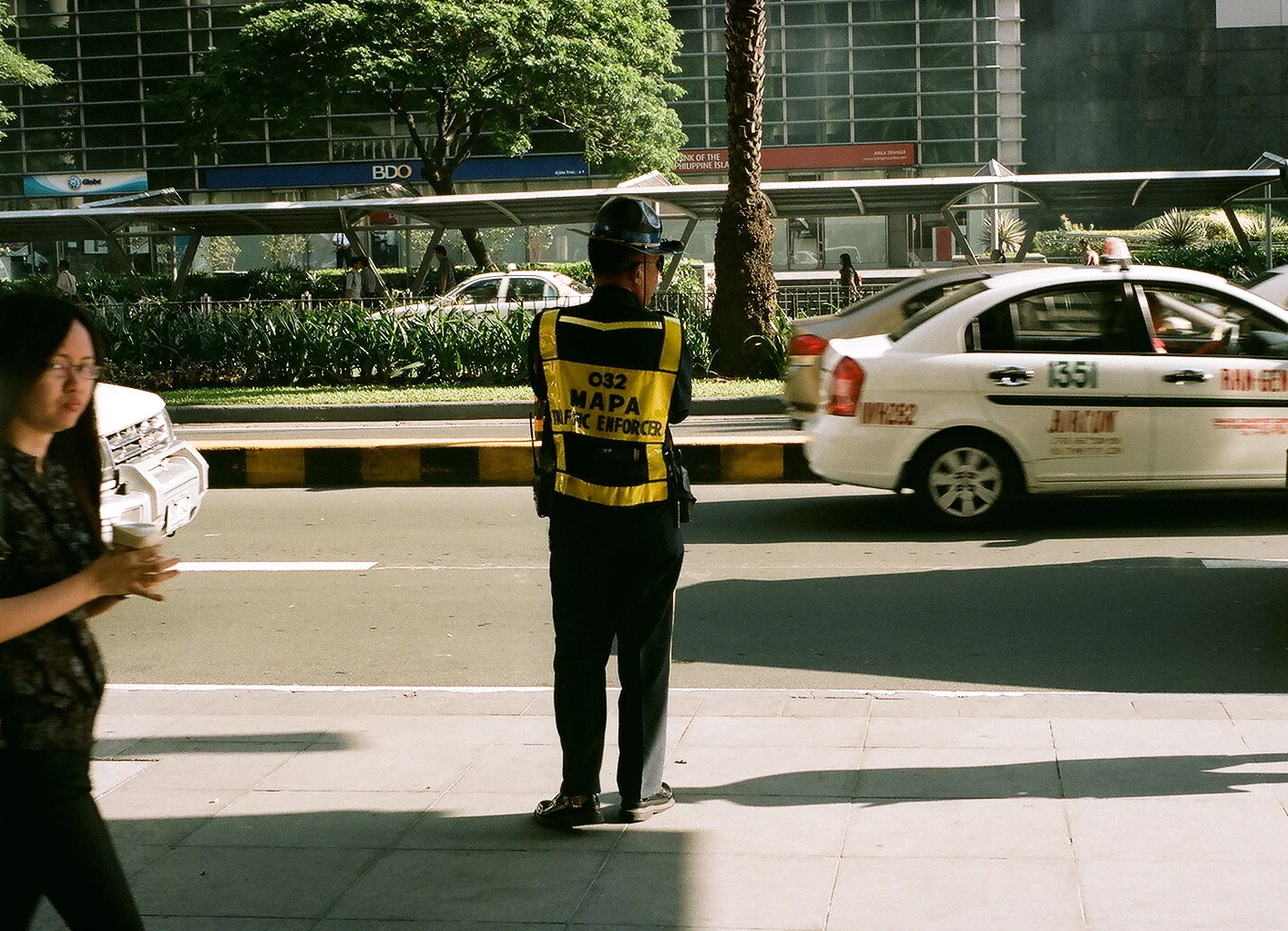 On the lookout, Makati, Manila, Philippines (Summer 2013) // Kodak Portra 160, Mamiya ZE-2, Epson V330 // Keeping Manila, a city riddled with terrible traffic, moving is the mission of these men. 