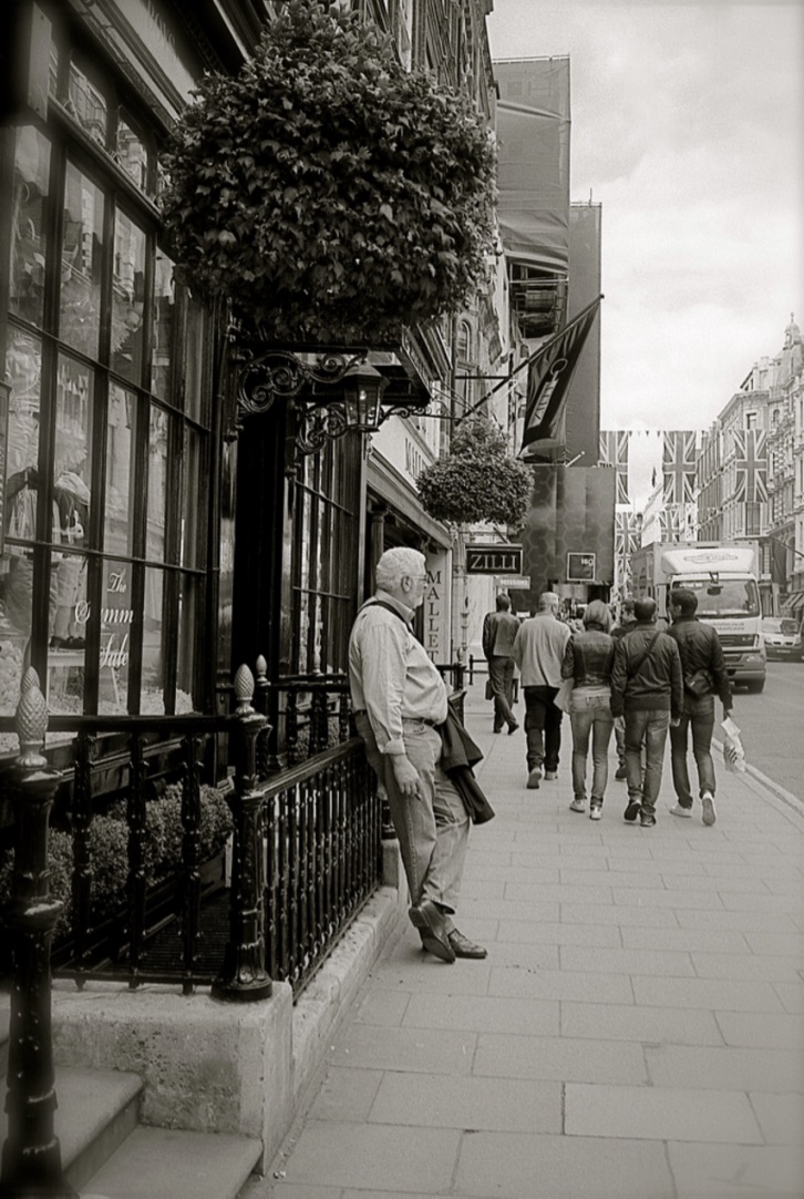 A cigar whilst I wait for my wife, New Bond Street, London, England (Summer 2012) // Ilford XP2 400, Minolta Himatic // Waiting can be beautiful. 
