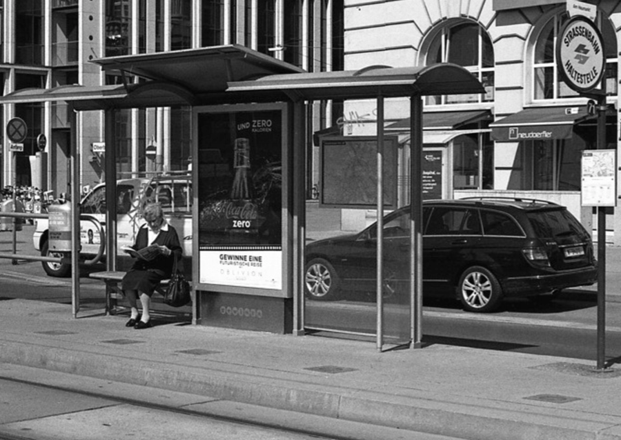 Just waiting, Vienna, Austria (19th April 2013) // Mamiya ZE-2 , Kodak T-Max 400, Epson V330 // There's a lot of waiting in life. Waiting for the bus, tram, train or taxi. Once we are on a mode of transport, we wait for the journey to end. We wait for the right person to come along. We wait for the rain to stop. We wait for results. We wait for the traffic to pass. We wait for paint to dry. We wait for for the supermarket queue to progress. Why do we spend so much time waiting? How can waiting time be used to enrich our experience of life? 