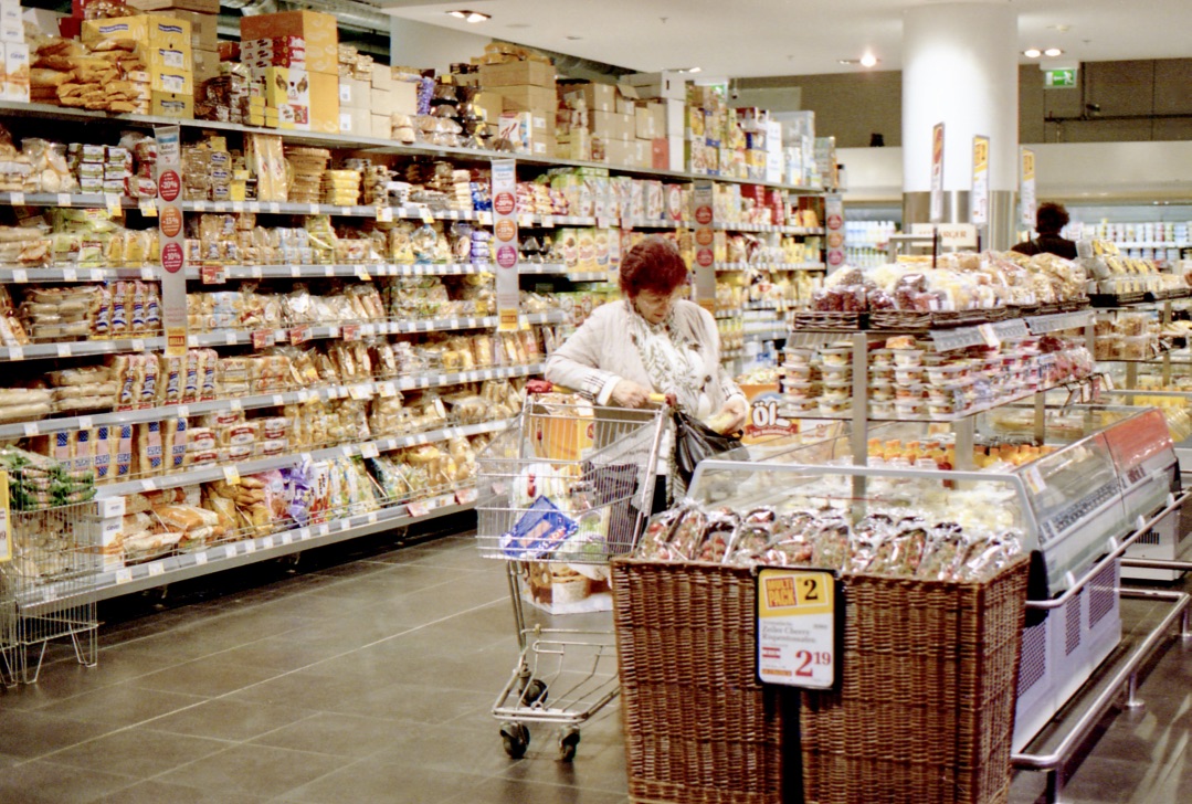 Everyday experience, Supermarket Unknown, Vienna, Austria (Spring 2013) // Kodak Portra 400, Olympus Om-2n, Epson V330 // I cannot quite tell if she is stealing or reading the back of the packet but I do wonder how this simple experience of heading to the supermarket is going to change or rather how can we improve it? Can we make it waste free? Can we enhance the quality of interaction between people? Do we need to have tills? 