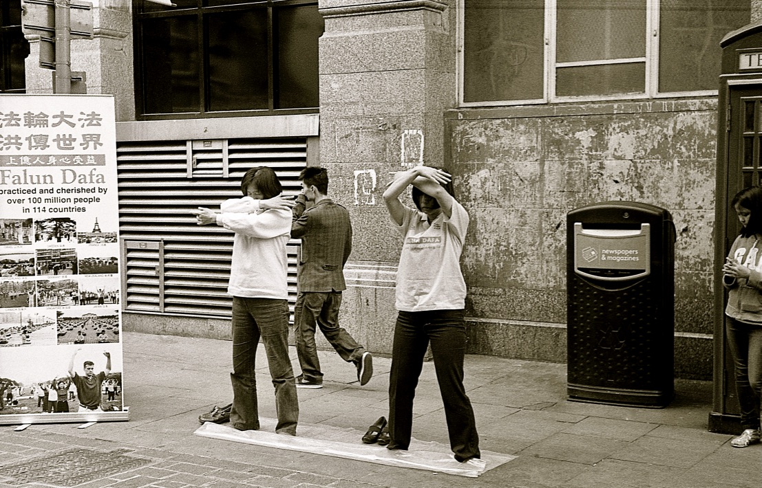 Falun Dafa, Soho, London, England (Summer 2013) // Kodak Tri-X 400, Olympus OM-2n, Epson V330 // Falun Dafa is a Chinese practice that combines meditation and qigong exercises based on the values of truthfulness, forbearance and compassion. 