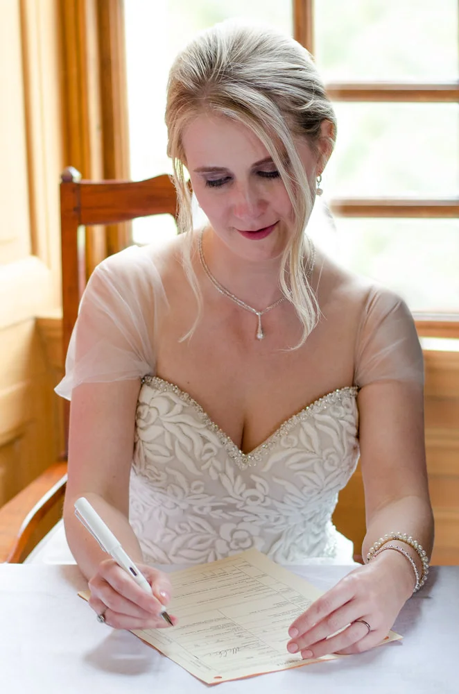 bride-signing-register-inreverie.jpg
