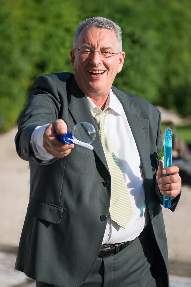groom-father-playing-bubbles-inreverie.jpg