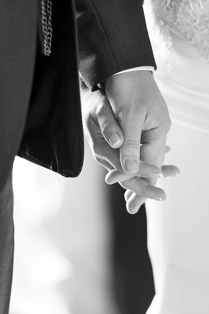 wedding-holding-hands-ceremony-in-reverie-b&w.jpg