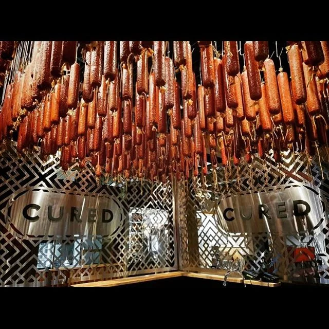 @curednewzealand full of delicious salami and open now in @riversidemarket.nz 
#meatsticks #salamiceiling #cured #christchurch #farmersmarket