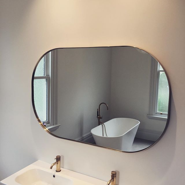Custom shaped oval Outline Mirror delivered and installed.

#brassnglass #customwork #bathroom #outlinemirror