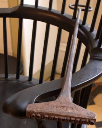 "Carpenters Co" was burned into the underside of each chair seat. William Dawson, maker of the brand, advertised himself as a "Cutler making scythes, sickles, iron work for grist and sawmills, chocolate mills, smith's bellows and most sorts of smith's work."