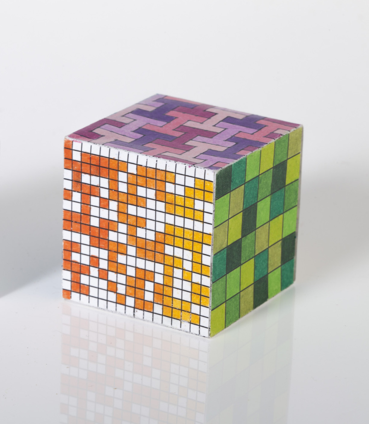 Cube with each side coloured in a different mathematical pattern