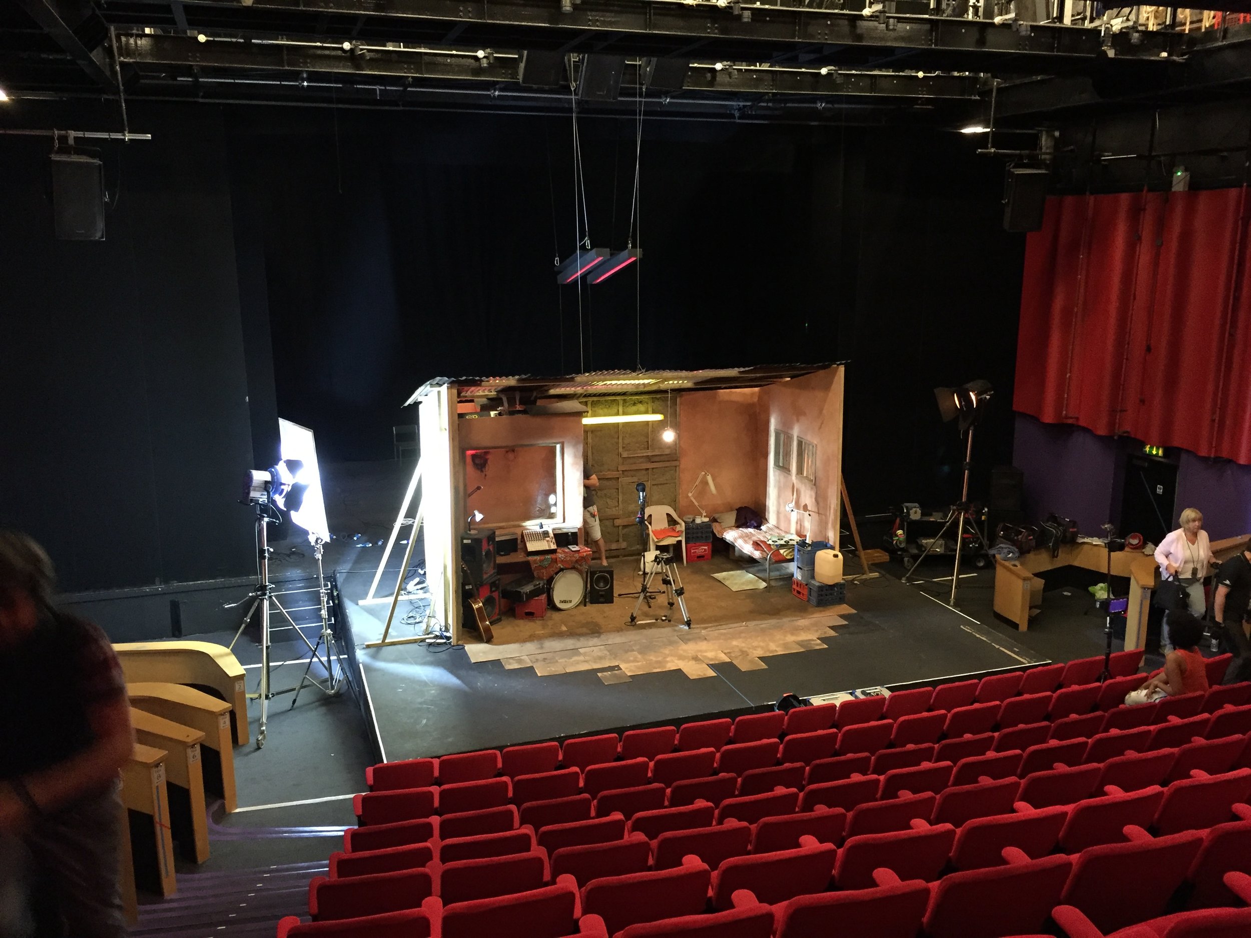  The final moment is a slow pull out revealing that the set is a construction on stage, gradually revealing the theatricality of the piece in its journey from stage, to screen. 