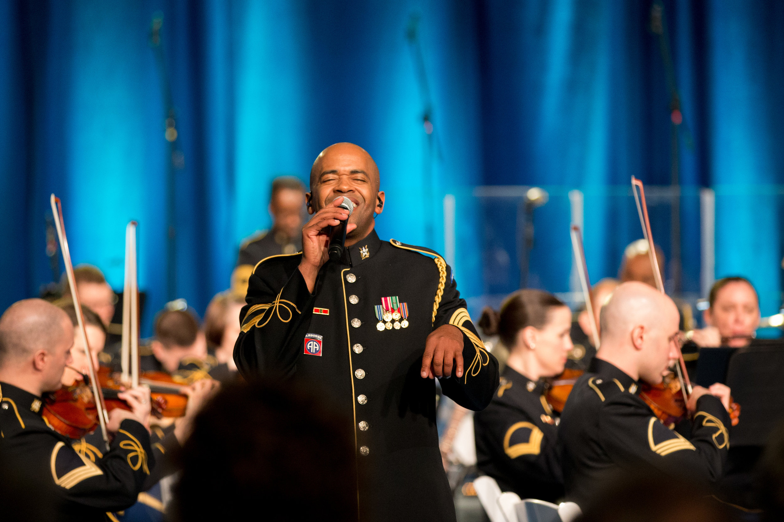  Master Sgt. Collin Eaton sings Ray Charles' popular version of America the Beautiful for veterans of the Vietnam War. 