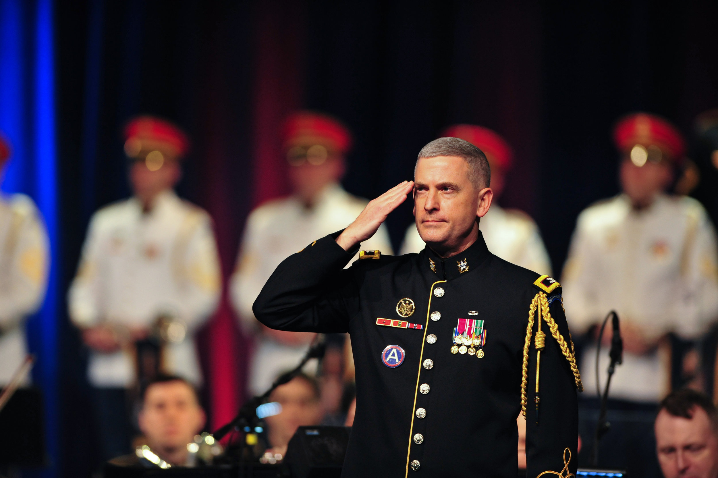  Col. Andrew J. Esch, Leader and Commander of The U.S. Army Band "Pershing's Own," salutes veterans of the Vietnam War. 
