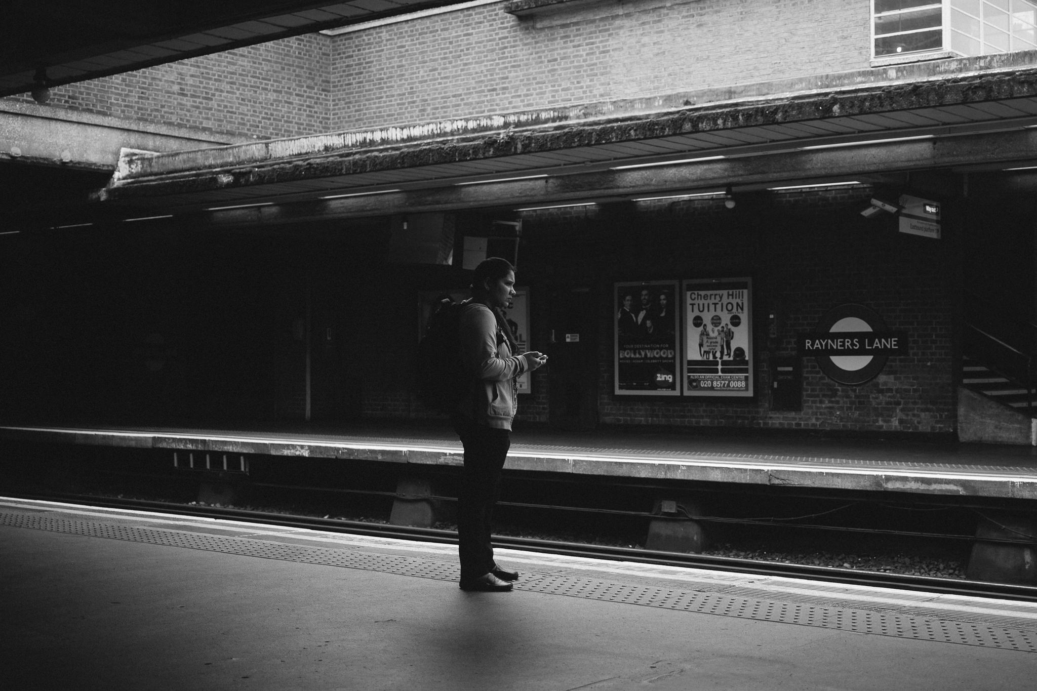 Lady waiting for london underground train
