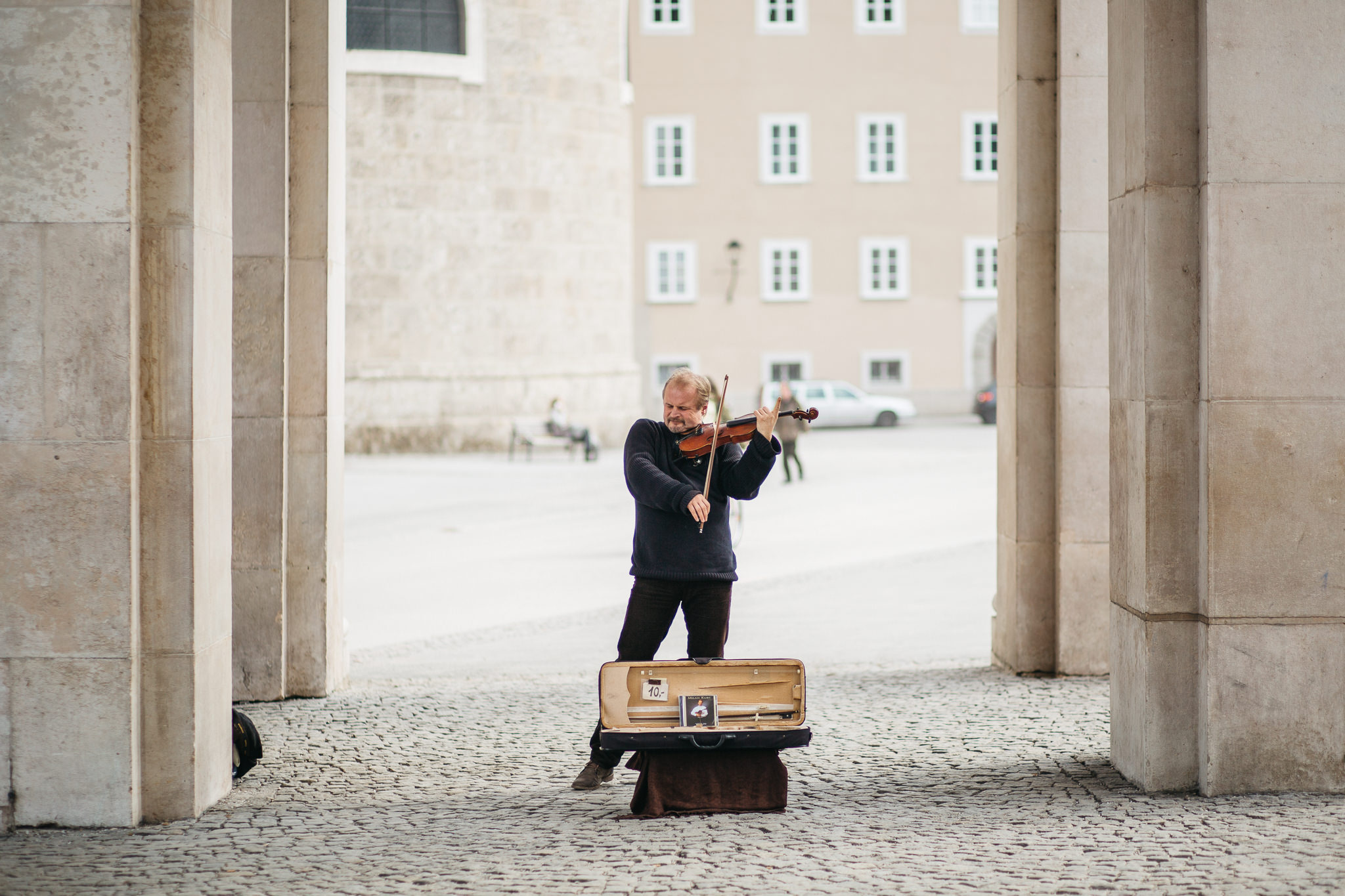 man playing violin in street