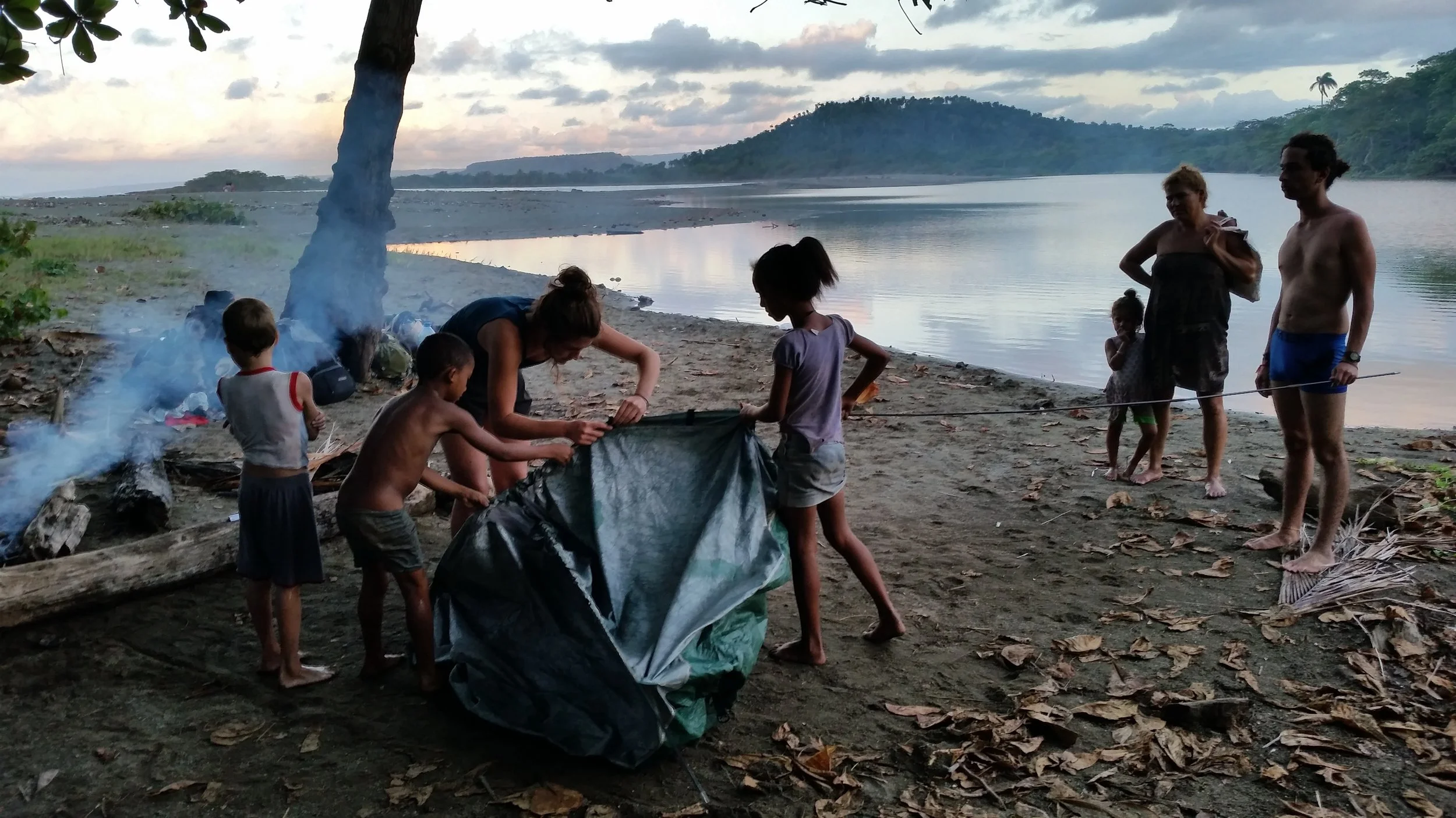 Local kids help us pitch our tent