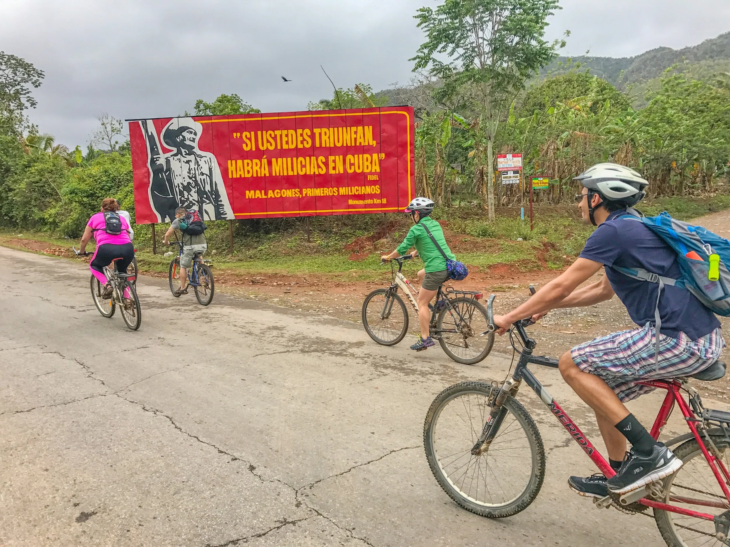 Biking through Vinales countryside to go zip-lining
