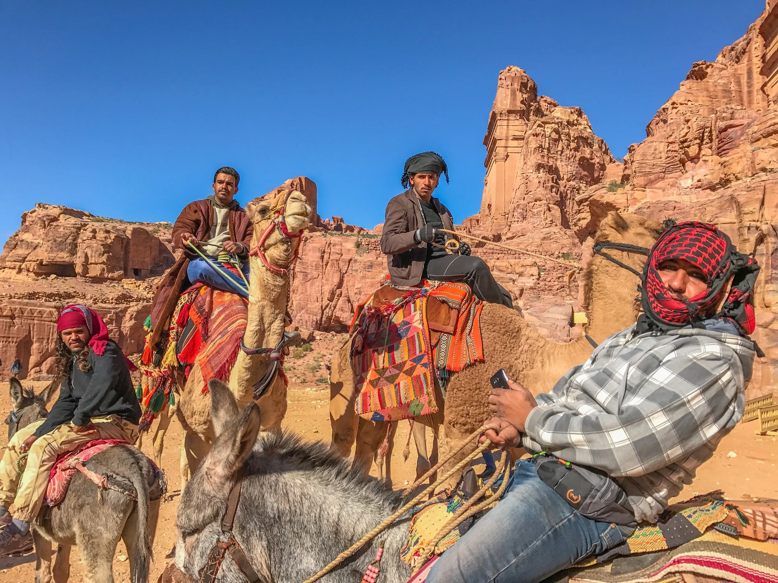 Petra Camel drivers, all wearing "Pirates of the Caribbean" eyeliner